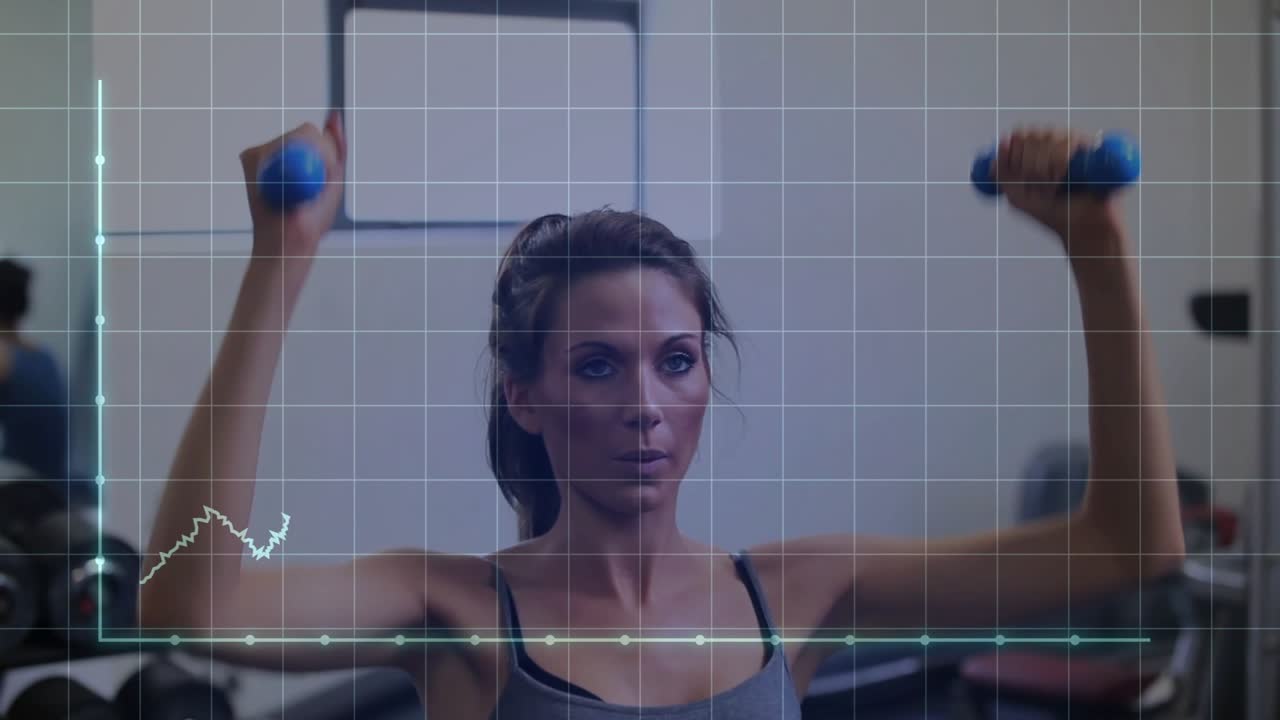 Woman adjusting on gym ball, wave tracking motion while overhead pressing blue weights for strength