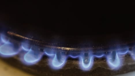 details with a burning match lightning up an old traditional gas stove.