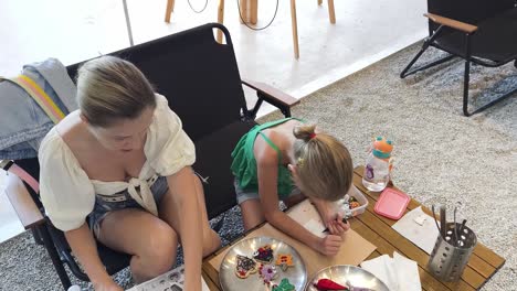 mother and daughter decorating cookies