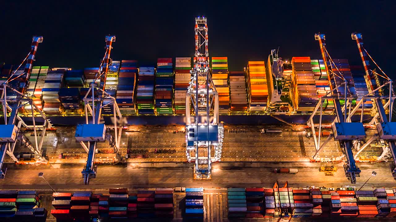 Aerial view, 4K.Time lapse Industrial port with Container port where is a part of shipping