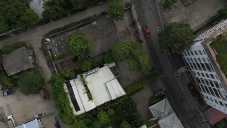 top view of buildings in the city neighborhood of phrom phong in bangkok, thailand. aerial drone shot