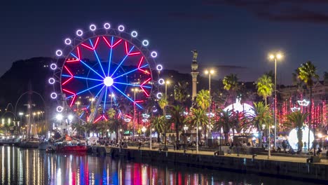 cityscape with reflections in the water of the port of barcelona,catalonia,spain.