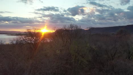 sunset over a river and forest