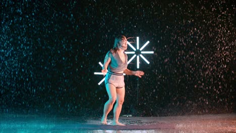 female dancer performing in slow motion rain, modern hip hop dancing