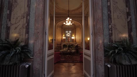 Slow-Forward-Dolly-Shot-Walking-Through-A-Double-Doorway-into-A-Stunning-Lounge-Area