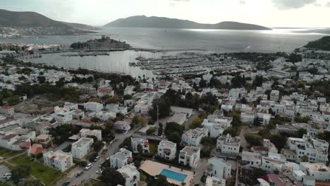 aerial view of the city of bodrum, turkey - white houses and marina in the view