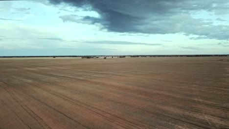 reverse drone flight over dry paddocks near berriwillock, victoria, australia, may 2021