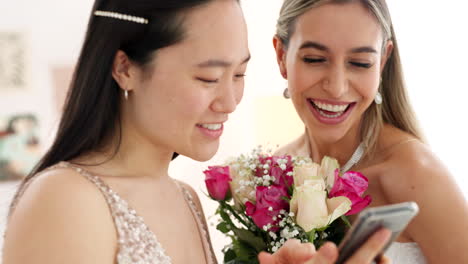 bride, bridesmaid and wedding picture with phone