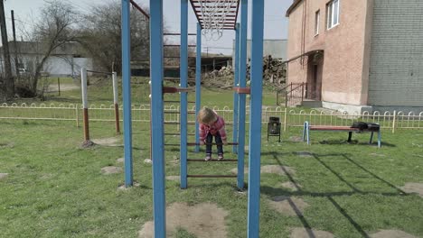 funny cute girl is playing. joyous female child having fun on playground