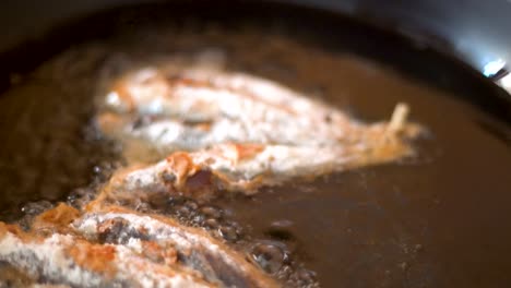 frying-sardines-in-a-pan