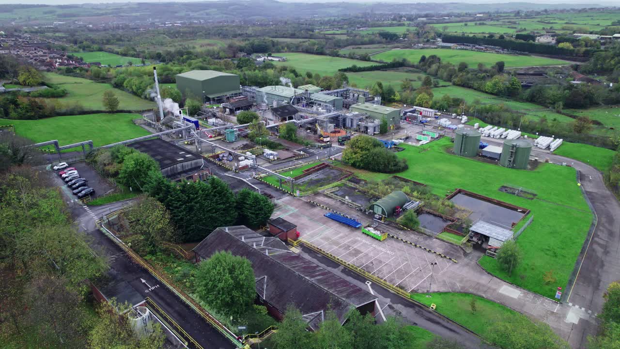Drone aerial footage view of a chemical plant with pipe constructions and processing departments