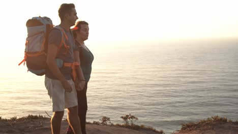 Happy-middle-aged-couple-with-camping-backpacks