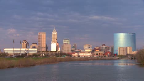 the city of indianapolis at dusk along the white river