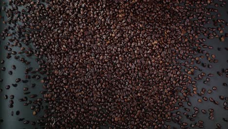 coffee beans roll over the surface