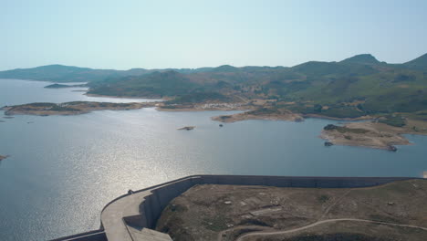 hydroelectric dam with camping site, fly by