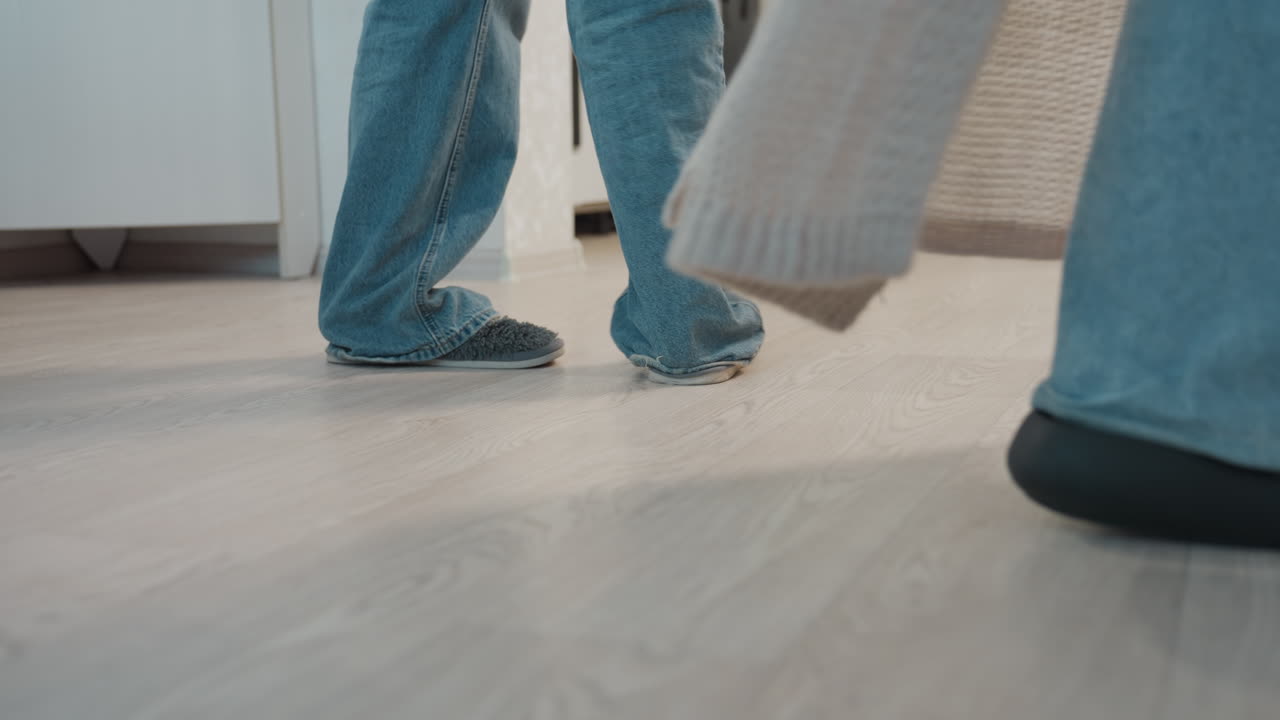 Intimate Dance Moment, Romantic Couple Dancing Quietly At Home, Soft Evening Scene Of Lovers Slow Dancing Indoors, An Intimate Evening As Partners Sway Slowly In Slippers On Wooden Floor