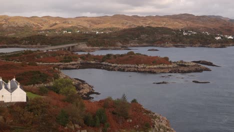 small white cottage on the idyllic islands of isle of skye, highlands of scotland