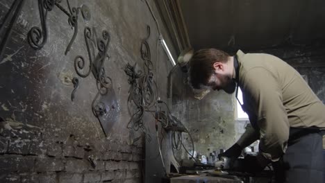 caucasian craftsman working in smithy