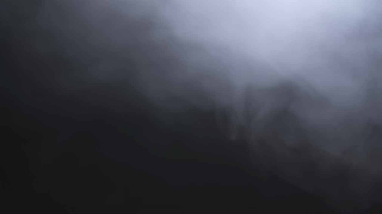 Atmospheric White Smoke Moving on Dark Background