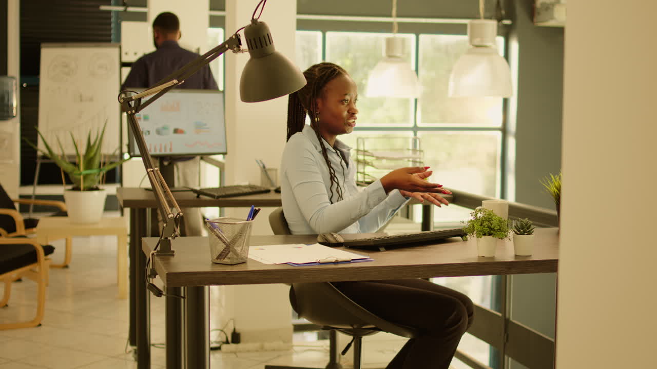 Woman Working at Desk in Office