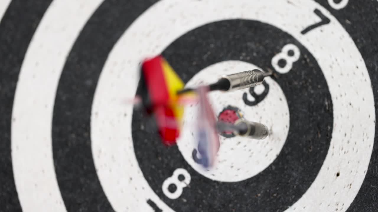 Four darts in colors of different flags