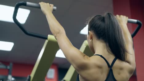 close view young woman does exercises on training device