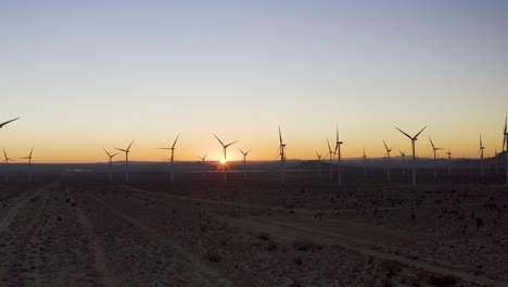 windmills in the mojave desert at sunrise