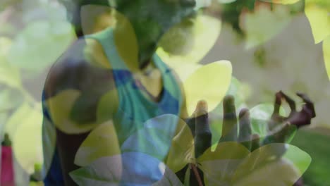 Animation-of-leaves-over-african-american-man-doing-yoga,-meditating,-slow-motion