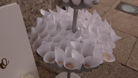 paper cones filled with rice set up for wedding ceremony exit