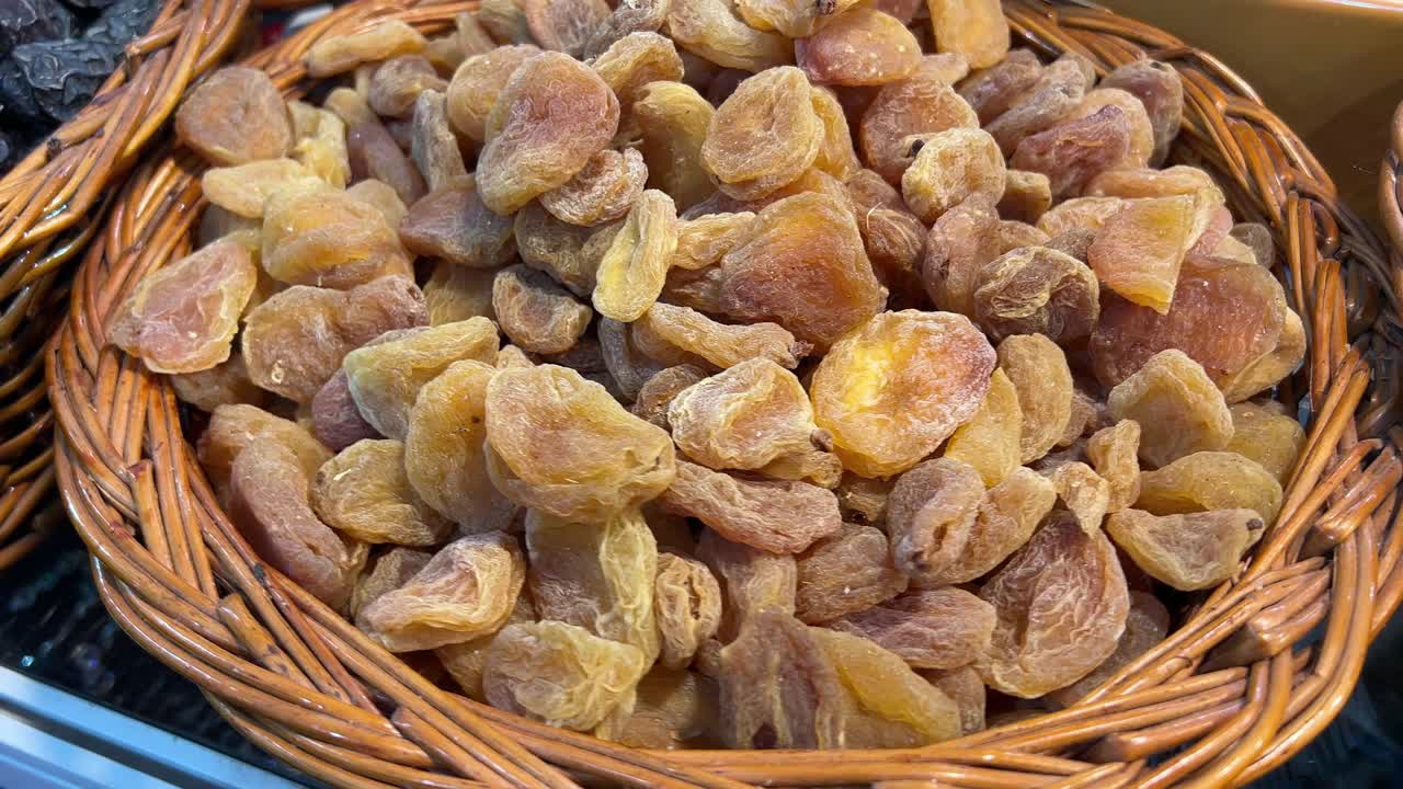 Profile view of basket full of amla candy from Afghanistan.