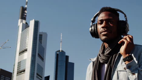 man with headphones in the city