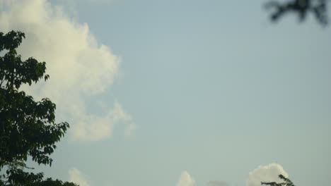 timelapse of clouds passing by in the sky up above during evening