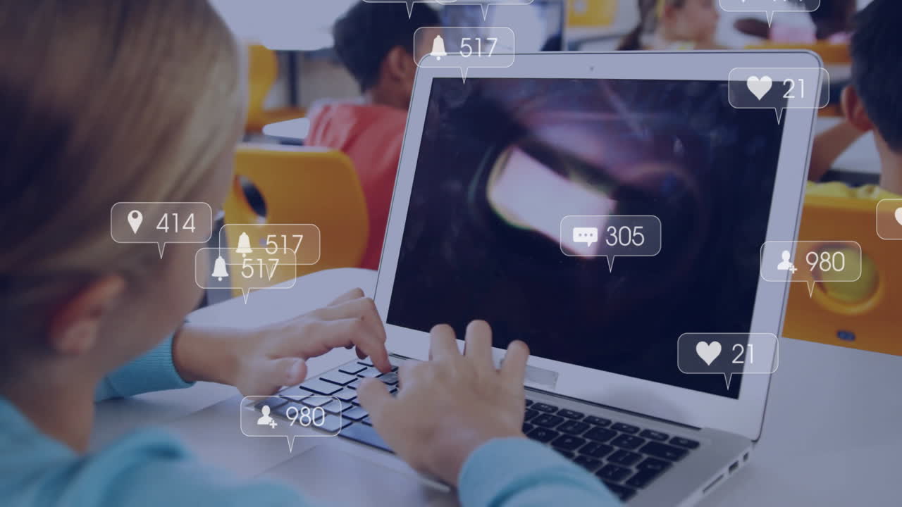 In school, child using laptop with animation of social media notifications
