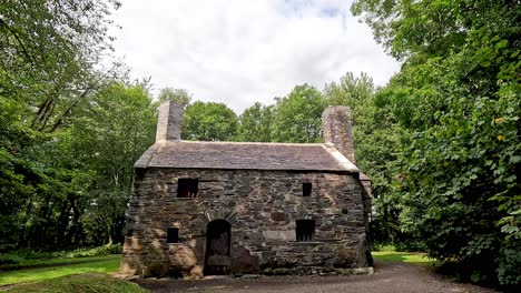 stone house surrounded by lush greenery