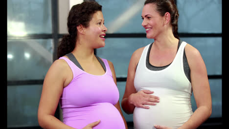 pregnant women chatting in gym