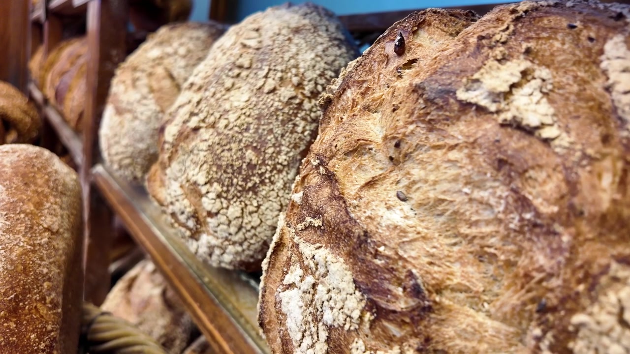 Close-up of Freshly Baked Sourdough Bread Loaves on a Bakery Shelf
