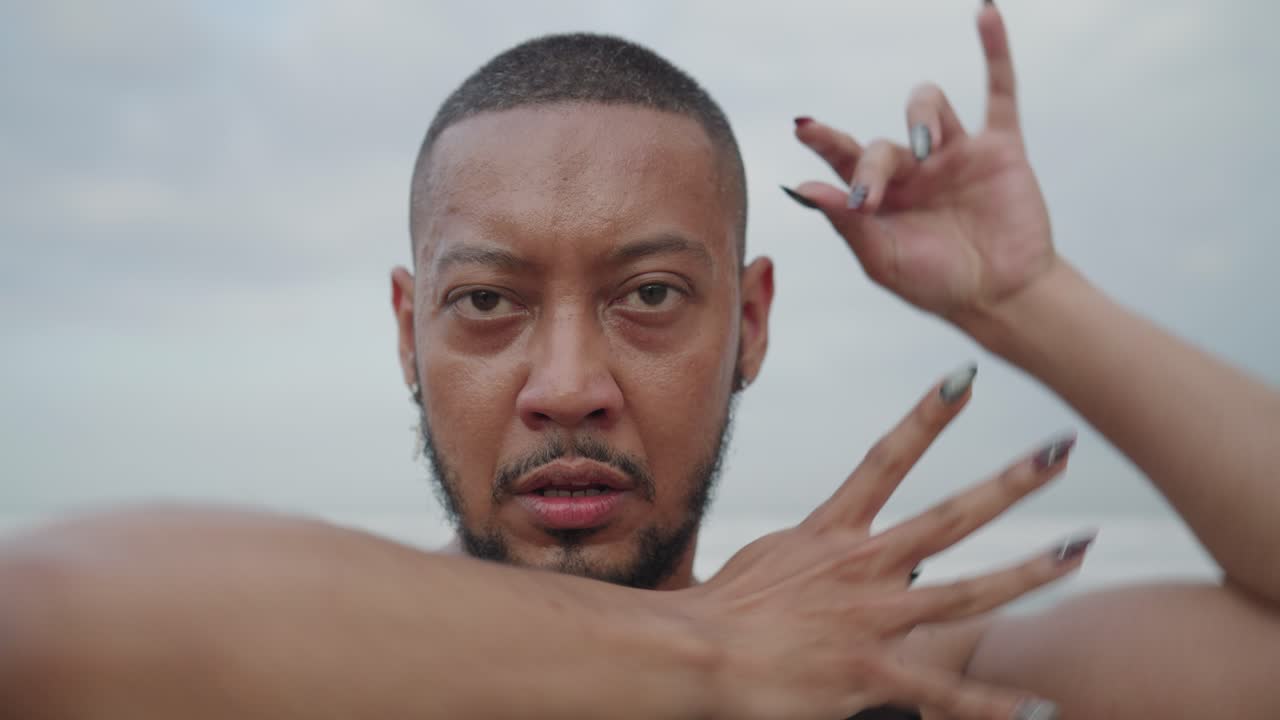 Black Man Dancing on Beach