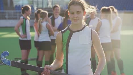 Female-hockey-players-smiling-and-looking-at-camera-