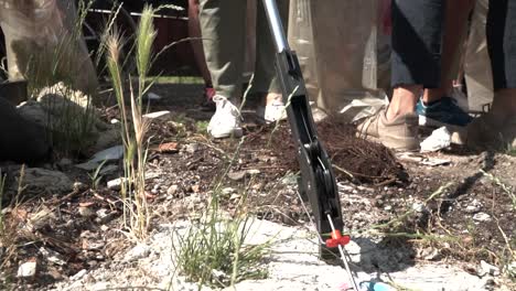 activists picking garbage in suburbs of milan italy