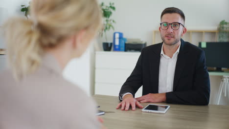 real estate agent talking to client in office