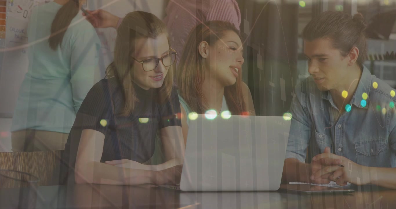 Diverse Team Collaborating on Laptop in Modern Office with Data Overlay