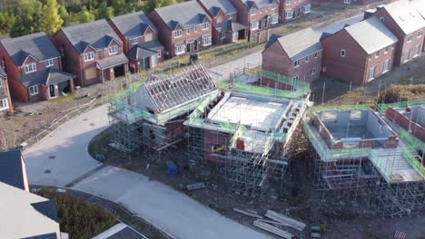 aerial view orbiting across suburban townhouse framework on development construction site