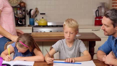 parents helping children doing homework