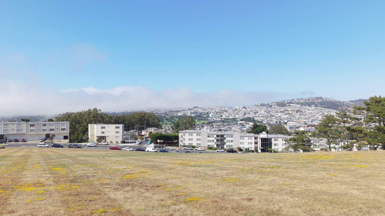 Flying over Broadmoor showcases a well-structured residential area quietly tucked along the edge of Daly City
