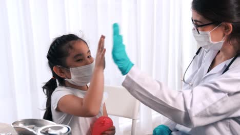 school girl visits skillful doctor at hospital for vaccination