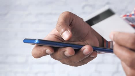 man making a mobile payment with credit card