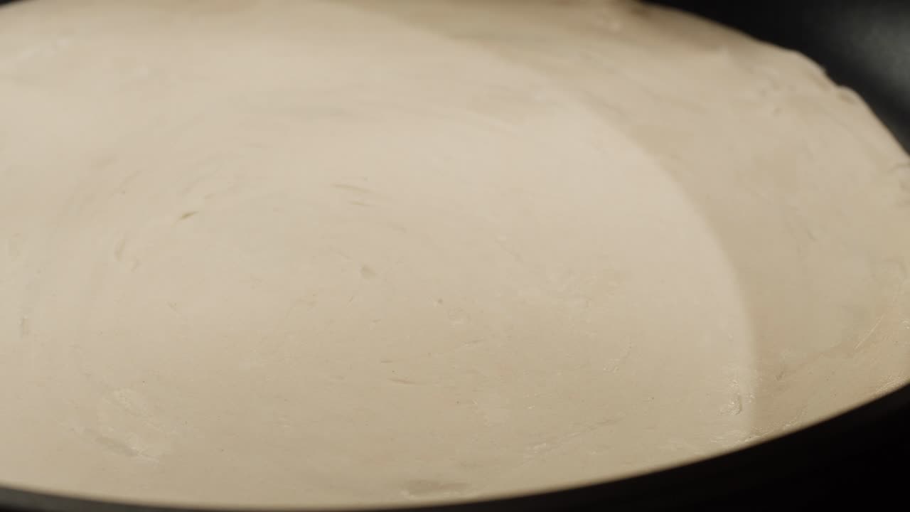 Cooking crepes in a pan
