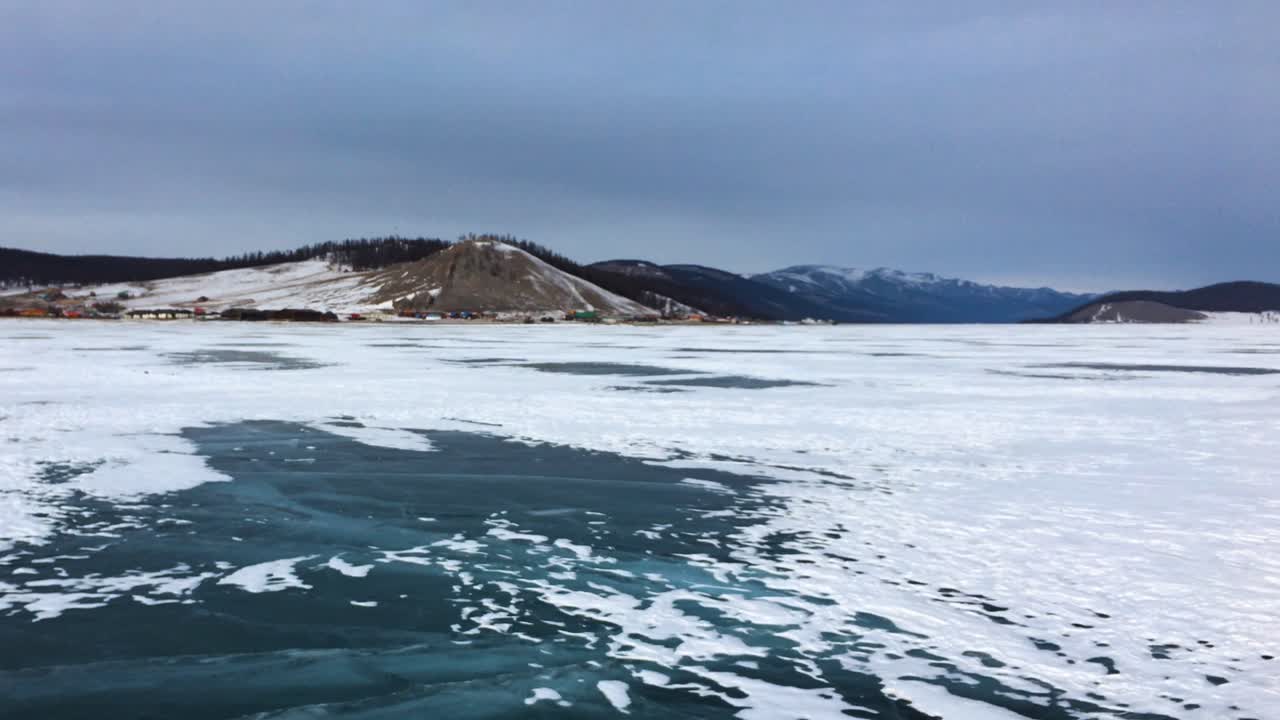 Snow-Covered Frozen Lake Khovsgol And Village Of Khatgal, Mongolia