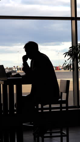 man waiting at airport