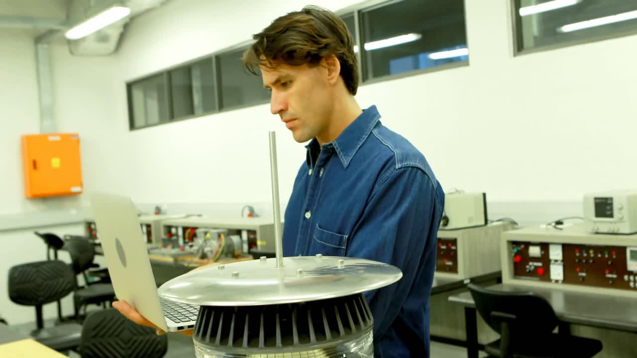 Male worker using laptop in office 4k